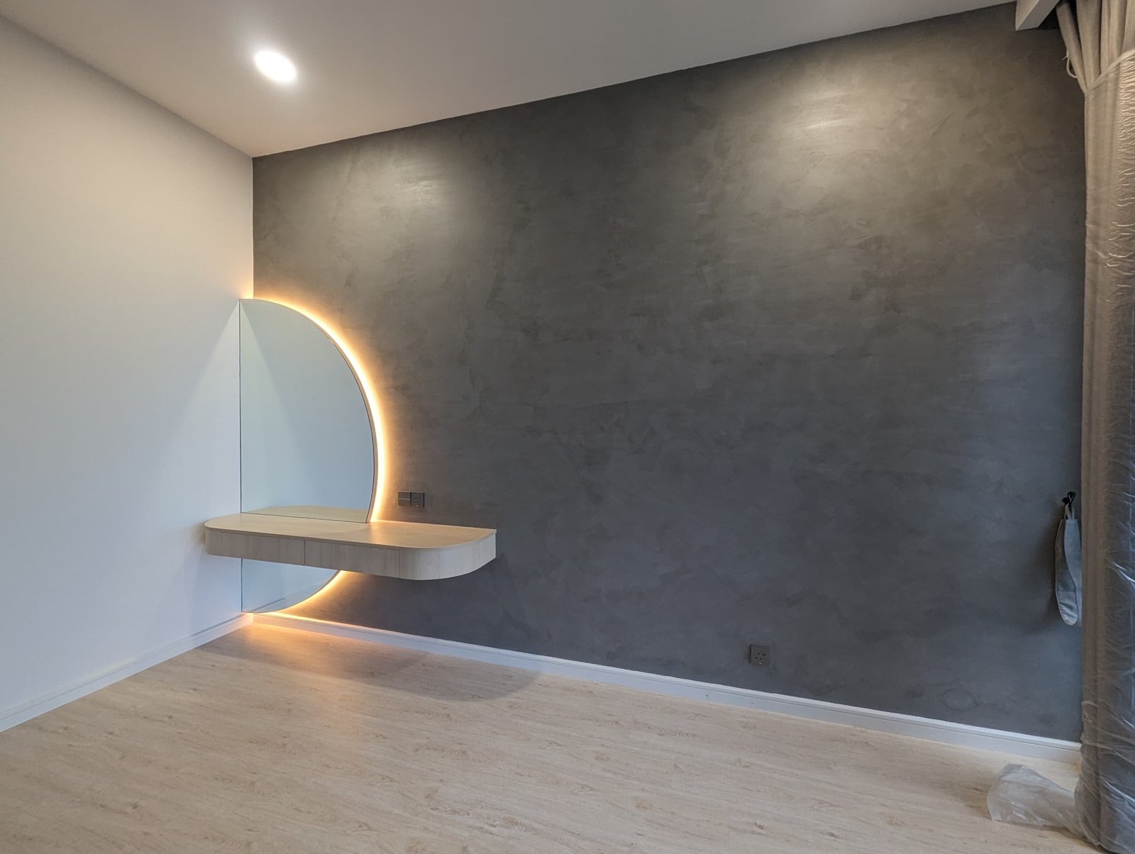 Custom curved vanity with feature lighting